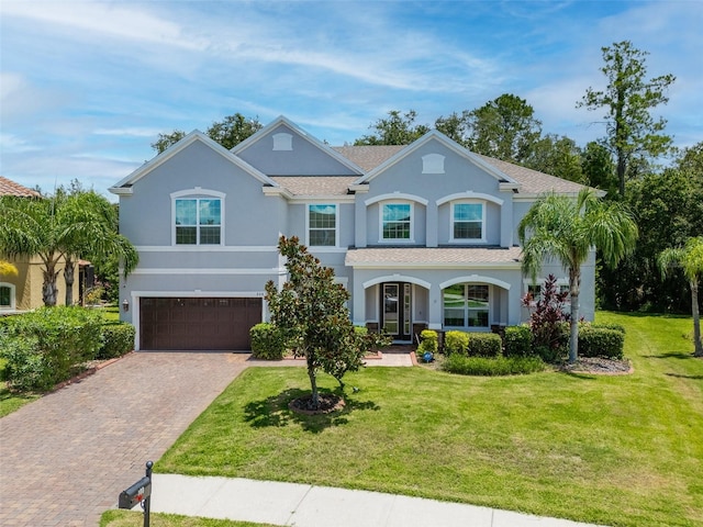 view of front facade featuring a garage and a front yard