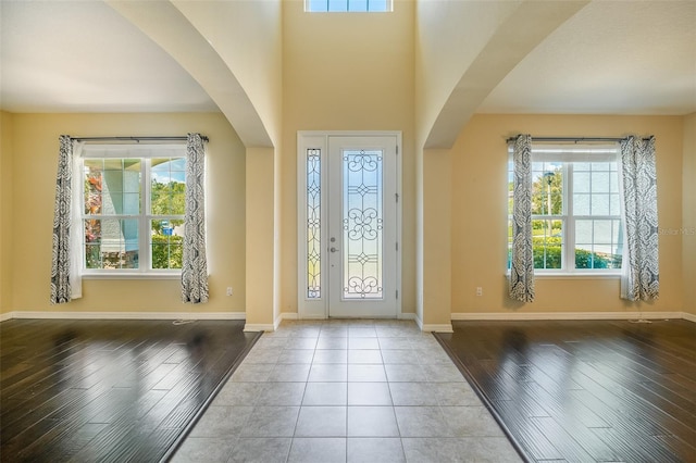 entryway featuring light tile patterned floors and a wealth of natural light