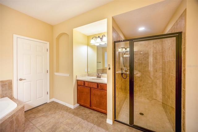 bathroom with tile patterned flooring, separate shower and tub, and vanity