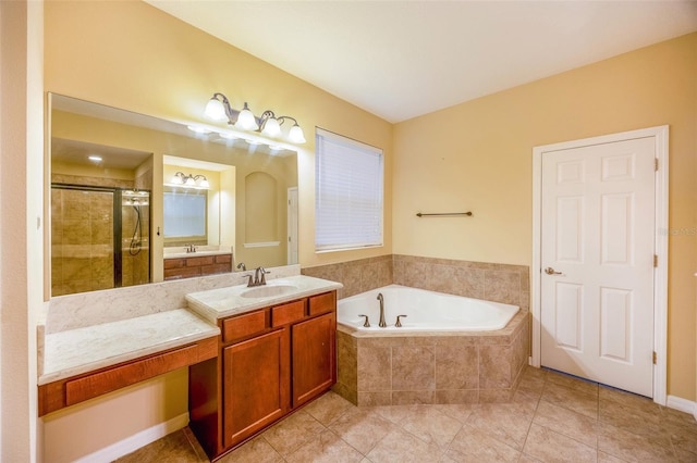 bathroom featuring vanity, tile patterned flooring, and plus walk in shower