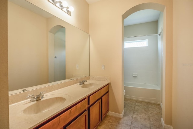 full bathroom with toilet, tile patterned flooring, shower / bath combination, and vanity