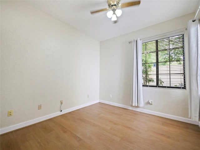 unfurnished room with light hardwood / wood-style flooring and ceiling fan