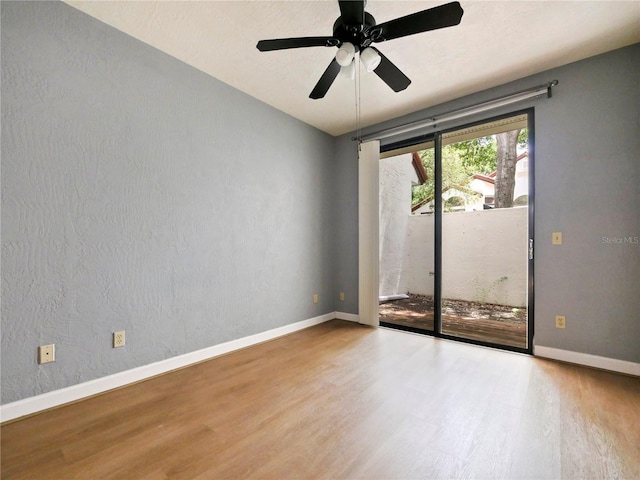 unfurnished room featuring hardwood / wood-style floors and ceiling fan