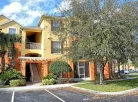 view of front of home featuring a balcony