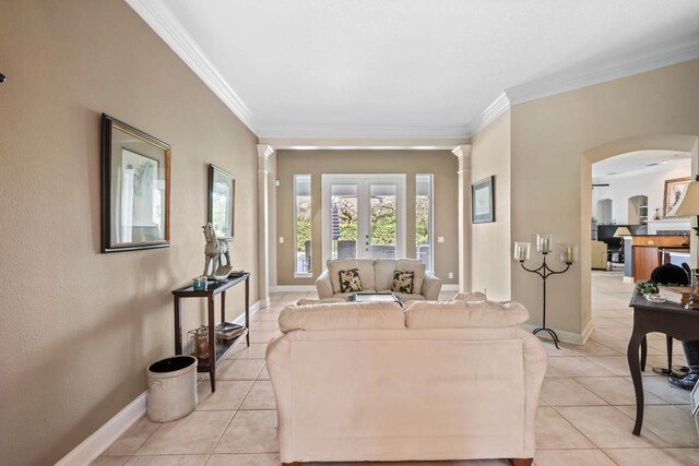 tiled living room featuring french doors and crown molding