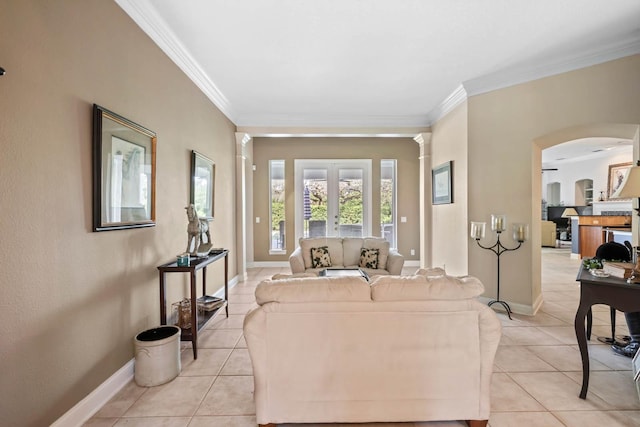 living room with ornamental molding, light tile patterned flooring, and french doors