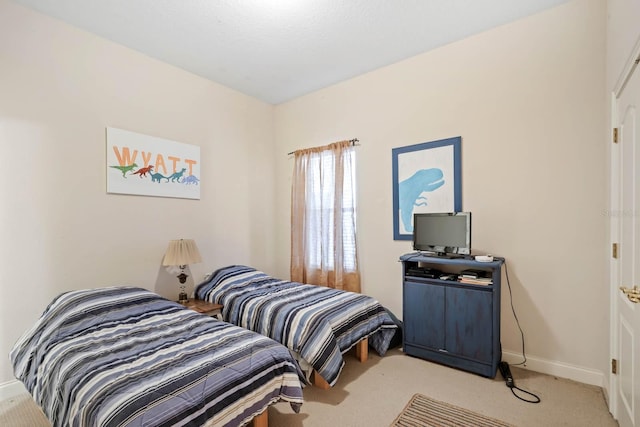 bedroom with light carpet