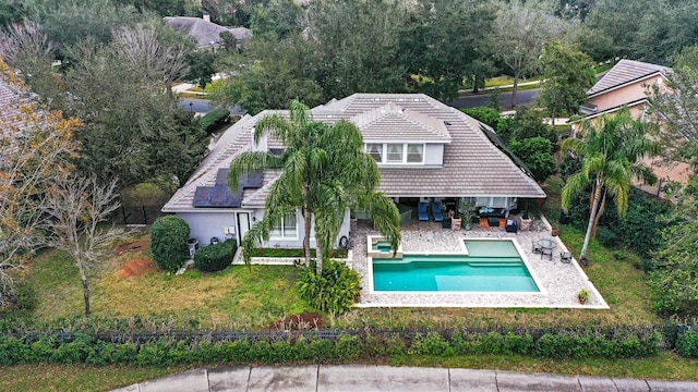 view of pool featuring a patio and a yard