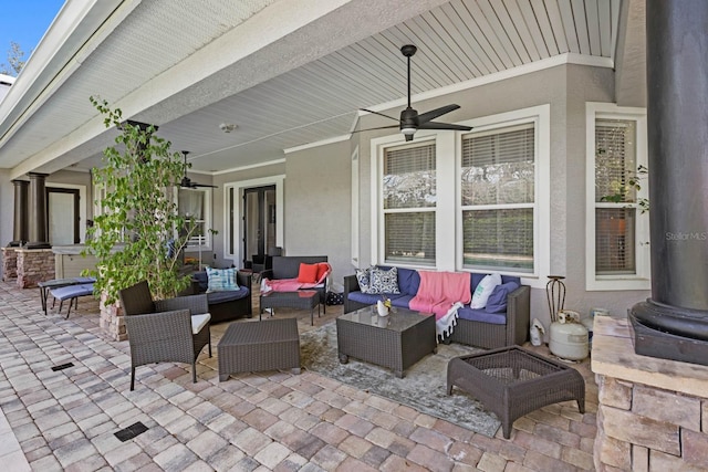 view of patio featuring ceiling fan and an outdoor hangout area