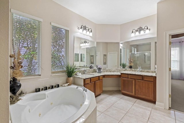 bathroom with vanity, tile patterned flooring, and plus walk in shower