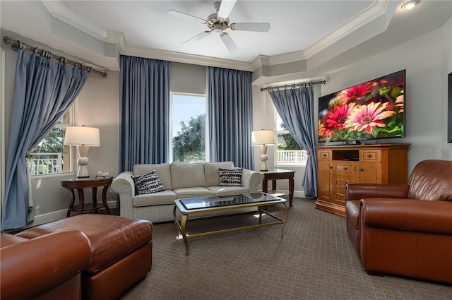 living room featuring crown molding, carpet, and ceiling fan