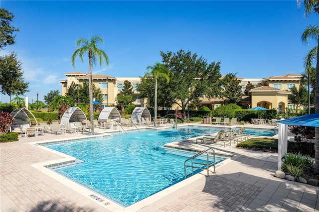 view of swimming pool featuring a patio area