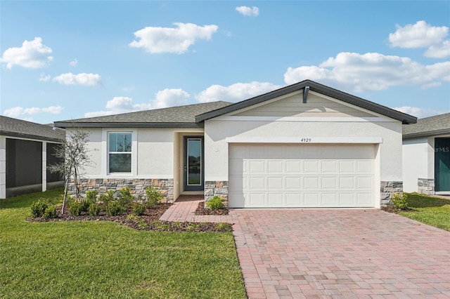 ranch-style home featuring stucco siding, a front lawn, a garage, stone siding, and decorative driveway