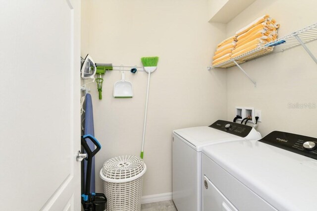 washroom featuring washing machine and clothes dryer