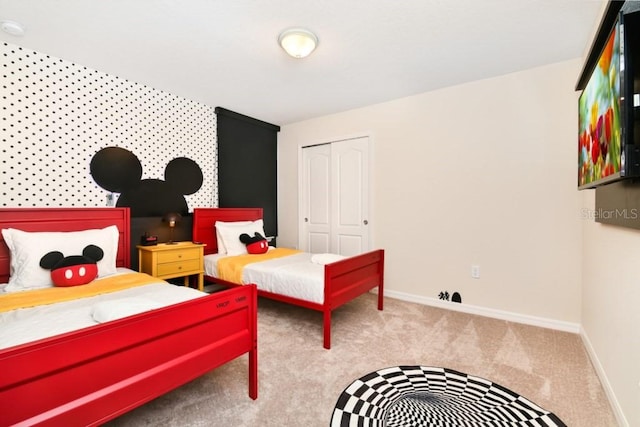 carpeted bedroom featuring a closet