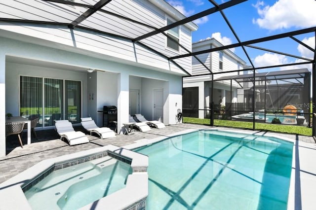 view of swimming pool with a patio area, an in ground hot tub, and glass enclosure