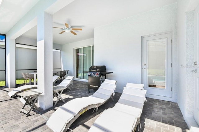 view of patio / terrace with grilling area and ceiling fan