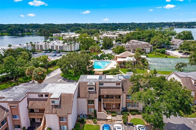 birds eye view of property with a water view