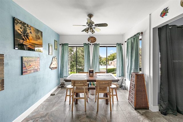 dining space featuring ceiling fan