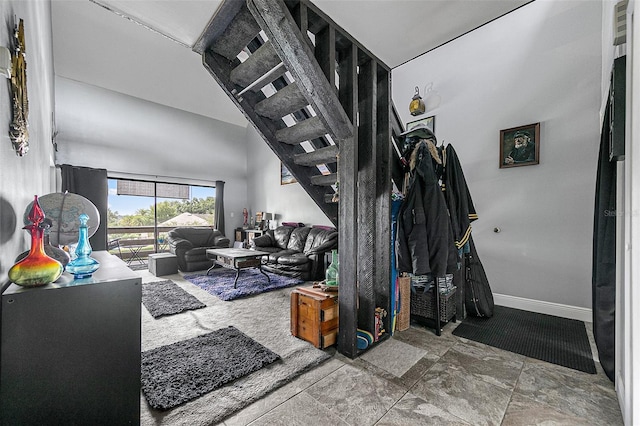 living room featuring a high ceiling