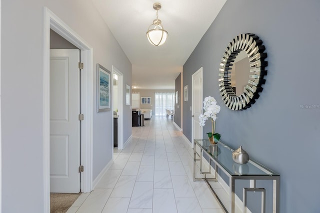 9076 Hazard St, Davenport, FL 33896 - corridor with baseboards and light marble finish flooring