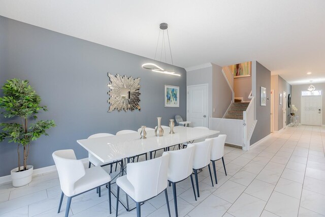 9076 Hazard St, Davenport, FL 33896 - dining space with stairs and baseboards