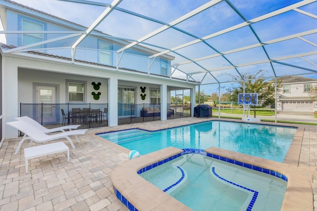 9076 Hazard St, Davenport, FL 33896 - view of pool featuring a patio, a pool with connected hot tub, glass enclosure, and outdoor dining area
