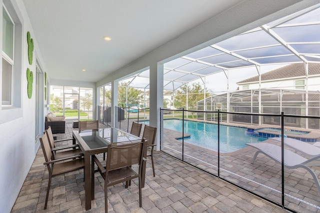 9076 Hazard St, Davenport, FL 33896 - sunroom / solarium featuring a jacuzzi, a swimming pool, and outdoor dining area