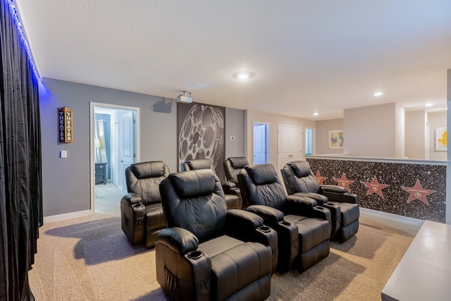 cinema room with carpet and a textured ceiling