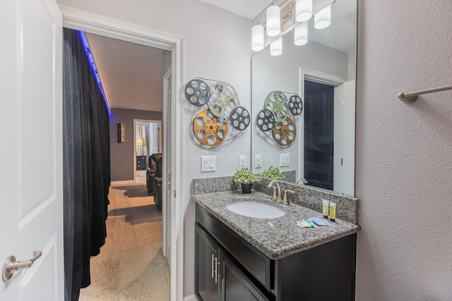 9076 Hazard St, Davenport, FL 33896 - bathroom with vanity and a textured wall