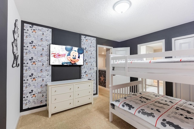 carpeted bedroom with a textured ceiling