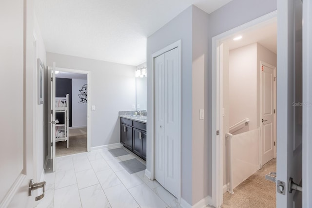 9076 Hazard St, Davenport, FL 33896 - bathroom featuring vanity and marble finish floors