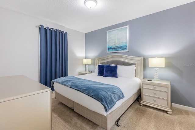 bedroom with light colored carpet