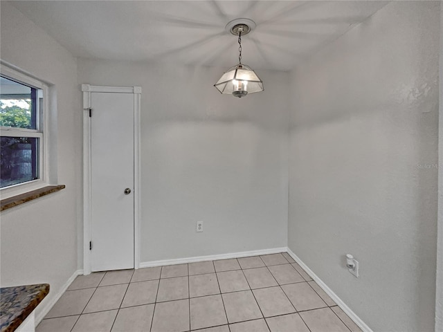 spare room featuring light tile patterned floors