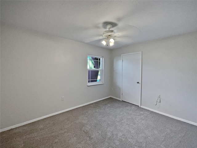 empty room with carpet and ceiling fan