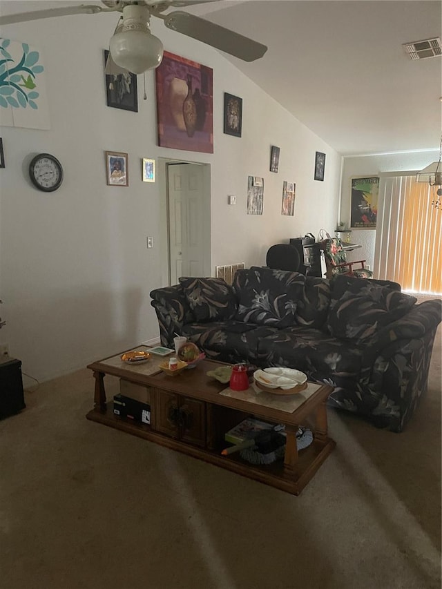 carpeted living room with vaulted ceiling, ceiling fan, and visible vents