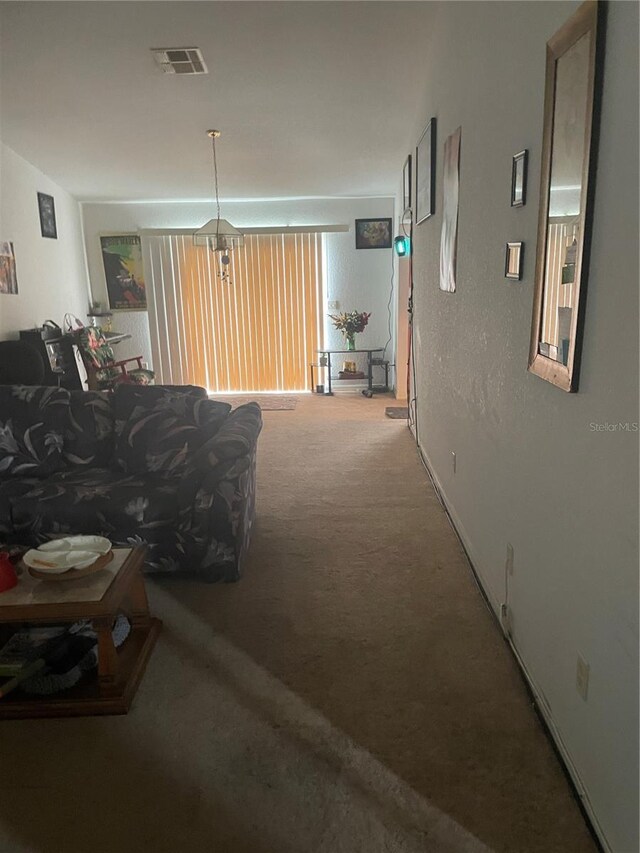 carpeted living area with visible vents