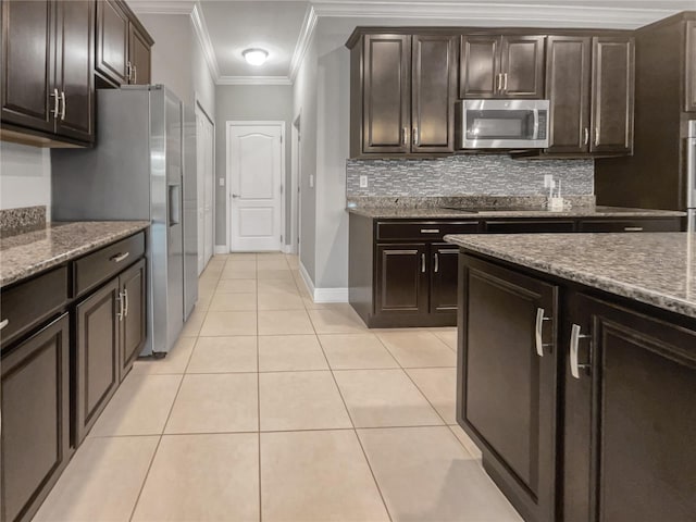 kitchen with crown molding, dark brown cabinets, and stainless steel appliances