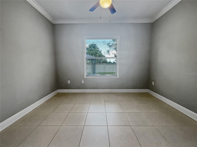 empty room with ceiling fan, crown molding, and light tile patterned flooring