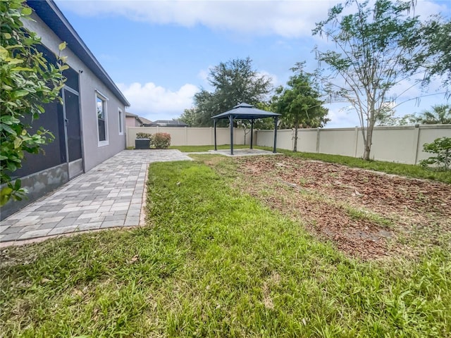 view of yard with a patio area and a gazebo