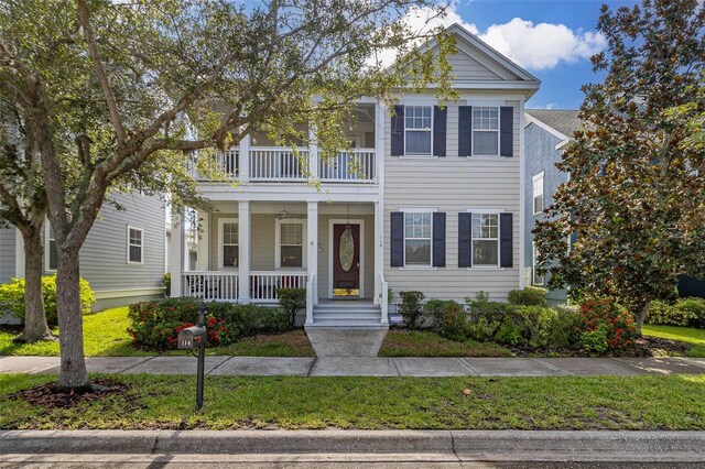 greek revival inspired property with a porch and a balcony