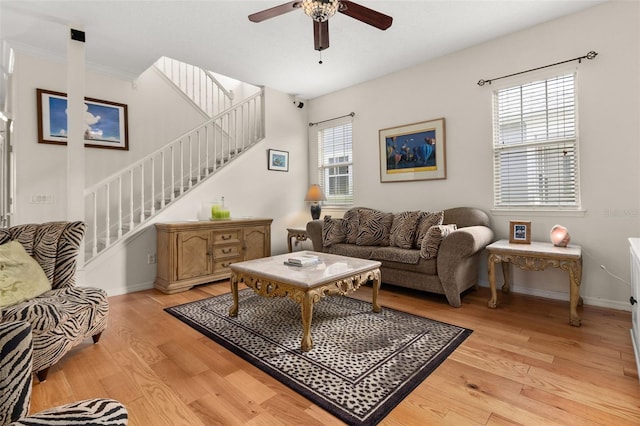 living room featuring ceiling fan and light wood-type flooring