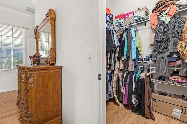 spacious closet featuring light hardwood / wood-style floors