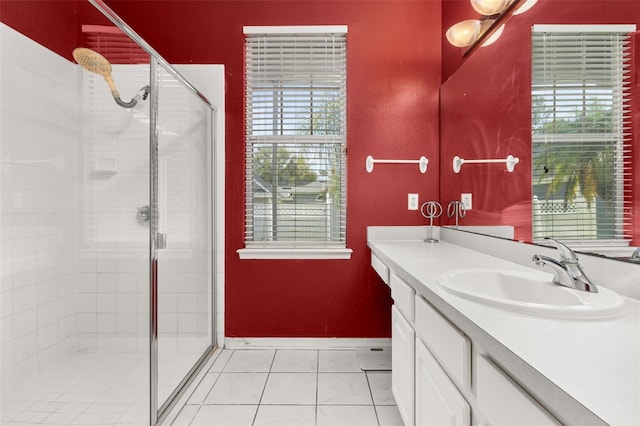 bathroom with vanity, tile patterned floors, and walk in shower