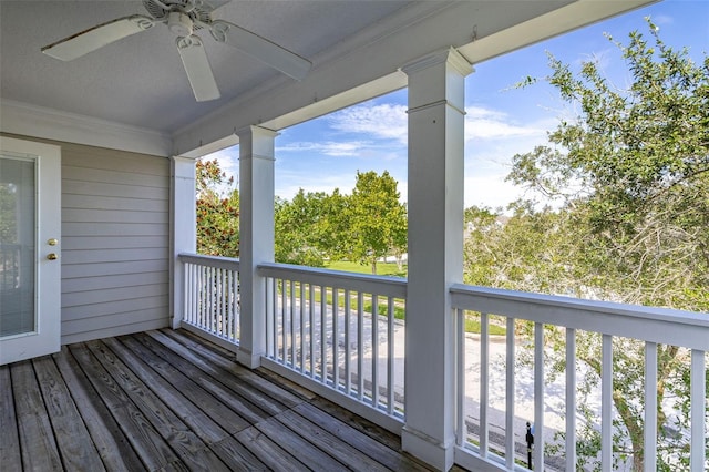 wooden terrace featuring ceiling fan