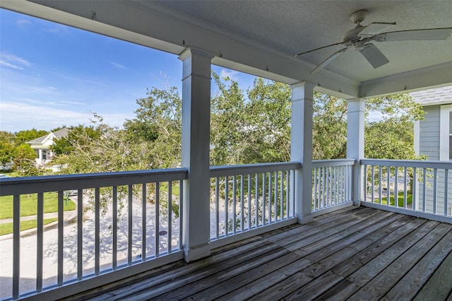 wooden deck with ceiling fan