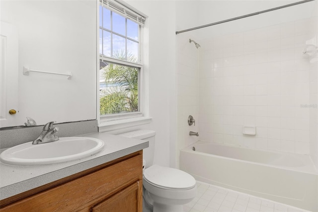 full bathroom with vanity, toilet, and tiled shower / bath combo