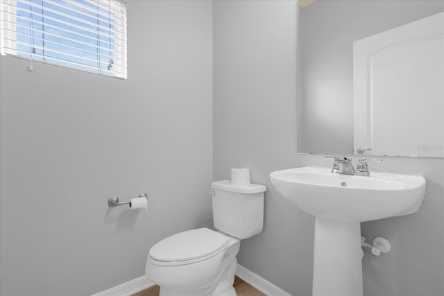 bathroom with sink and toilet