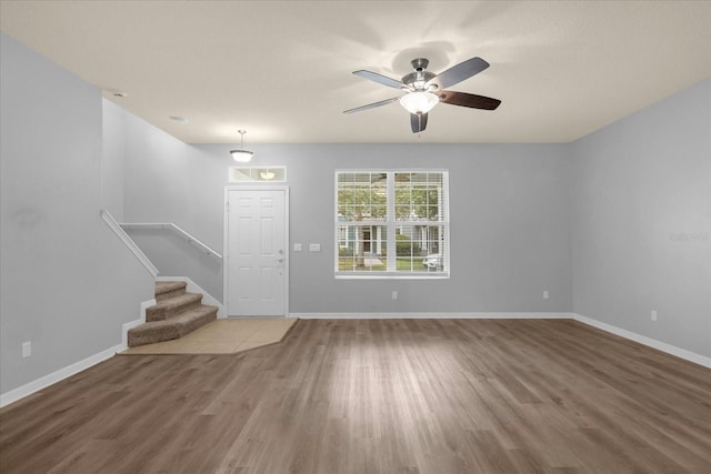 interior space with wood-type flooring and ceiling fan