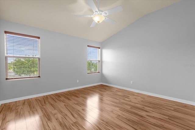 unfurnished room featuring ceiling fan, lofted ceiling, and light hardwood / wood-style floors